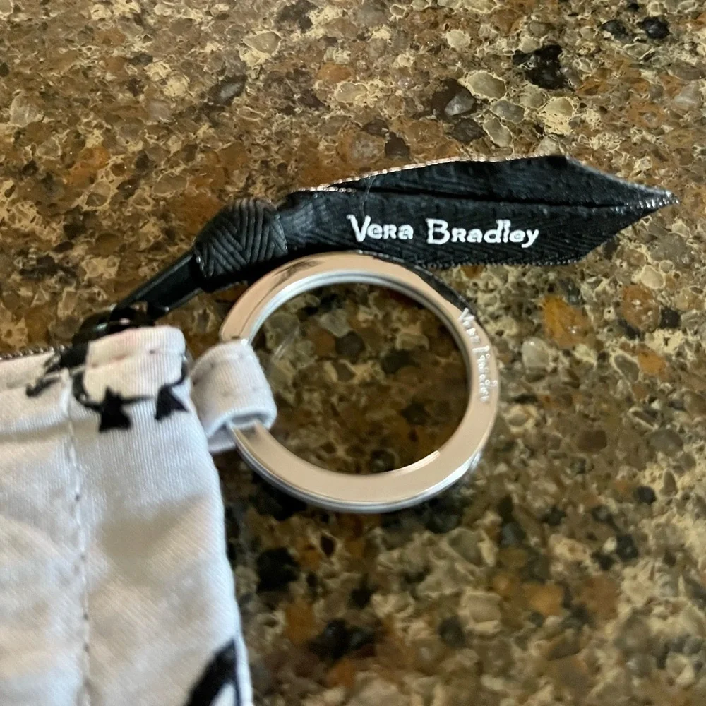 VERA BRADLEY CHANGE & ID PURSE. IN NEW CONDITION. 5”W X 3 1/2”H.